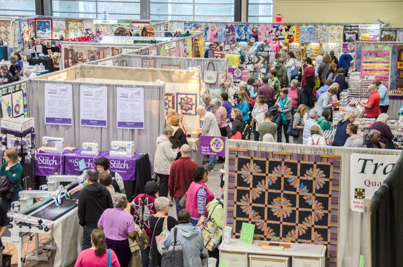 Aisle of I am AQS Vendors at an AQS QuiltWeek Show